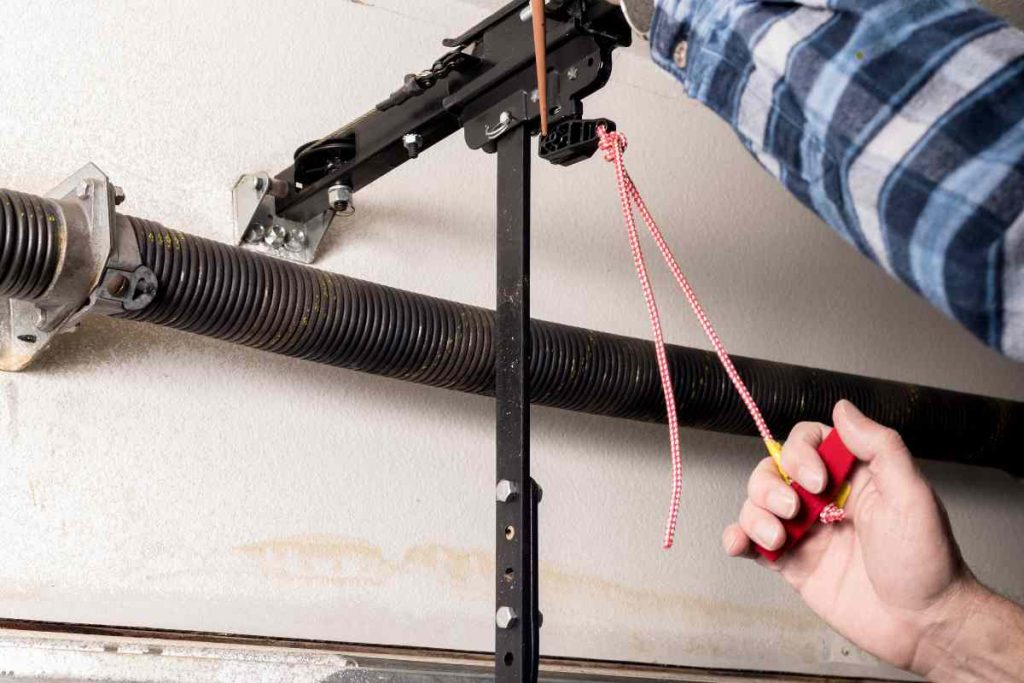 garage door broken spring symptoms